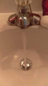 Water running from a bathroom faucet